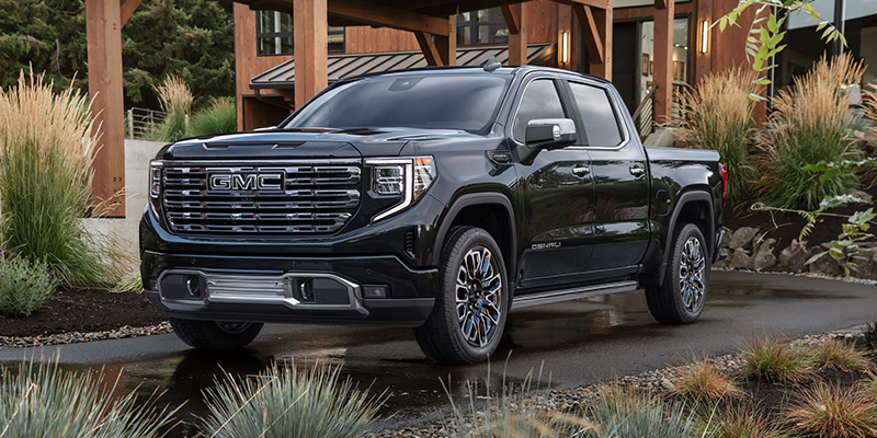Black 2026 GMC Sierra 1500 parked in a desert home carpark
