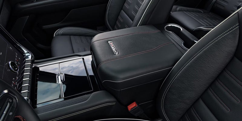 Close-up of the black leather front center console and seating.